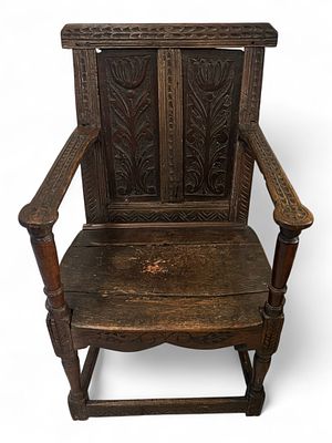 English Carved Oak Joint Stool Armchair, 17th Century. A remarkably early English carved oak 