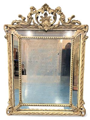 Large Rococo Revival Giltwood Mirror with Cherub Crest, 19th Century. A grand Rococo Revival 