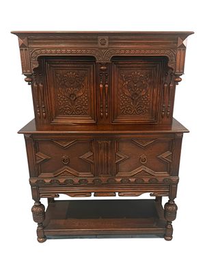 Carved Oak Renaissance Revival Sideboard with Upper Cabinet, Late 19th Century. A richly carved 
