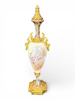Sevres-Style Hand-Painted Porcelain Urn with Gilt Bronze Mounts. A finely executed Sevres-style 