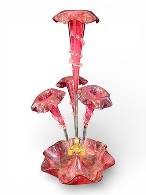 Victorian Cranberry Glass Four-Trumpet Epergne. Victorian cranberry-hued glass epergne with a 