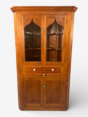 American Cherry Gothic Motif Corner Cabinet. A handsome American cherry corner cabinet crafted 