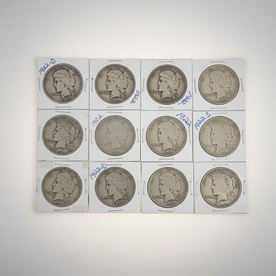 Twelve (12) 1922 Peace Silver Dollars Mixed Mint Group .900 Fine Silver. Group of twelve 1922 
