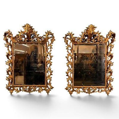 Pair of Italian Rococo Revival Giltwood Mirrors, Late 19th/Early 20th Century. Pair of ornate 