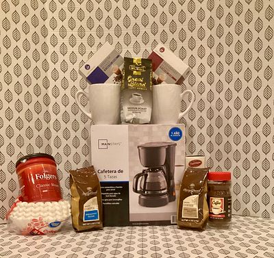 Get Caffeinated. 5 cup coffee maker w/ several packages of coffee and 2 mugs