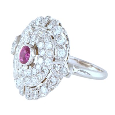 50. Ring with central ruby and diamonds rosette. Platinum. Brilliant cut diamonds and round cut 