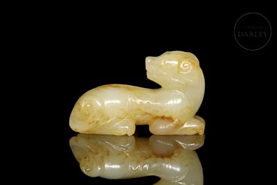 Carved jade figure “Dog,” Qing dynasty. Carved jade figure, light in colour, with ochre veins 