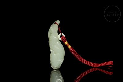 Jade figure ‘Fruit with lingzhi’, Qing dynasty. White jade carving with slight greenish hues 