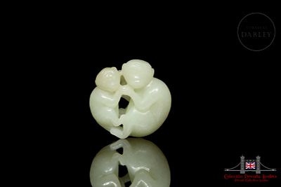 Carved jade figurine “Monkeys”, Qing dynasty. Jade of a soft tone and milky texture, carved in 