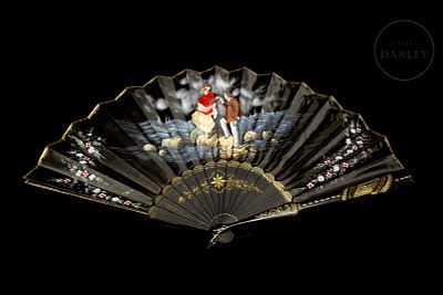 Black silk and wood fan, 20th century. Fan with black silk backing. Features a hand-painted 
