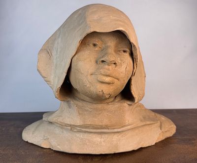 Escultura orientalista de terracota representando el busto de una "joven pastora con turbante 