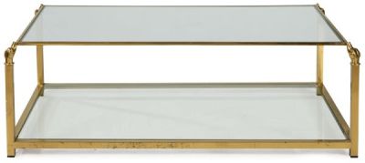 Mesa de centro de metal dorado con cabezas de perros sujetando la tapa de cristal. Sigo XX 