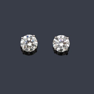 : Dormilonas con pareja de brillantes de aprox. 1,40 ct en total. Dormilonas con pareja de 