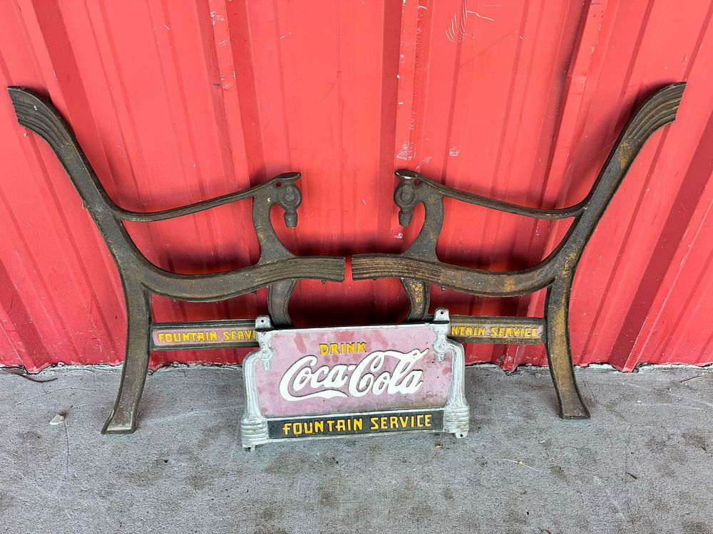 Lot 255: Antique Cast Iron Bench Ends and Sign