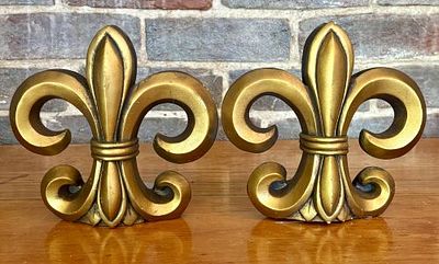 A Pair of Silvestri Gold Tone Fleur-de-Lis Bookends - 6.5"x6.5"x7". This pair of decorative 