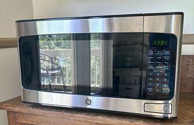 GE 1.1 Cubic Foot Stainless Steel Countertop Microwave Oven Model JES1145SH1SS 16"X20"X13". A 
