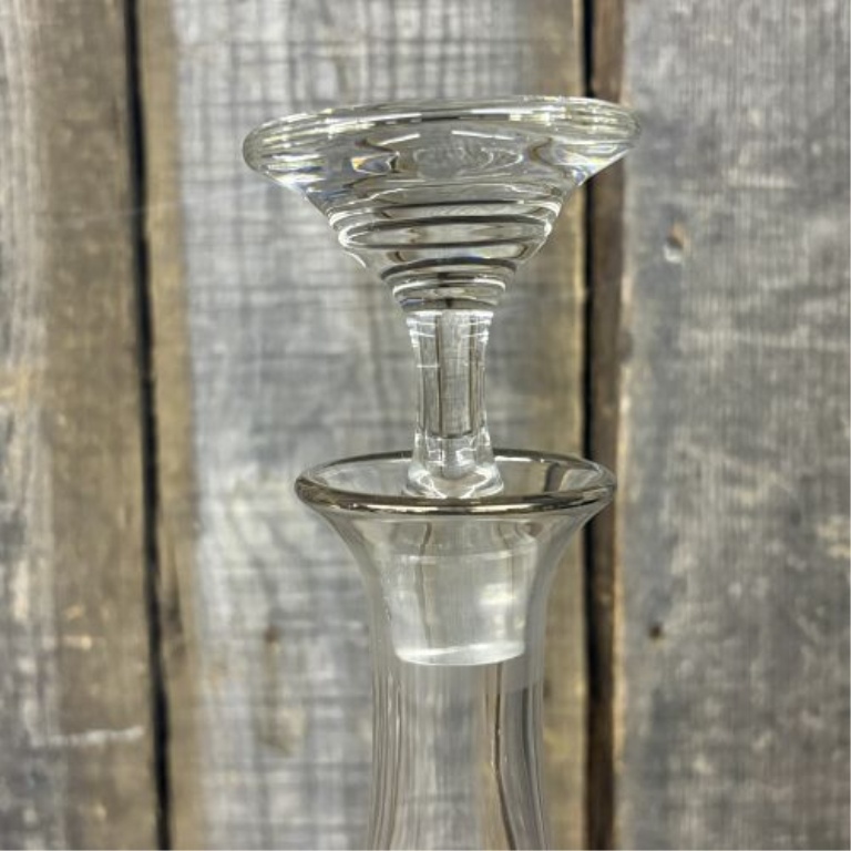 Two Glass Decanters Including a Square Cut Crystal Spirit Decanter and a Flared Decanter with Metallic Trim