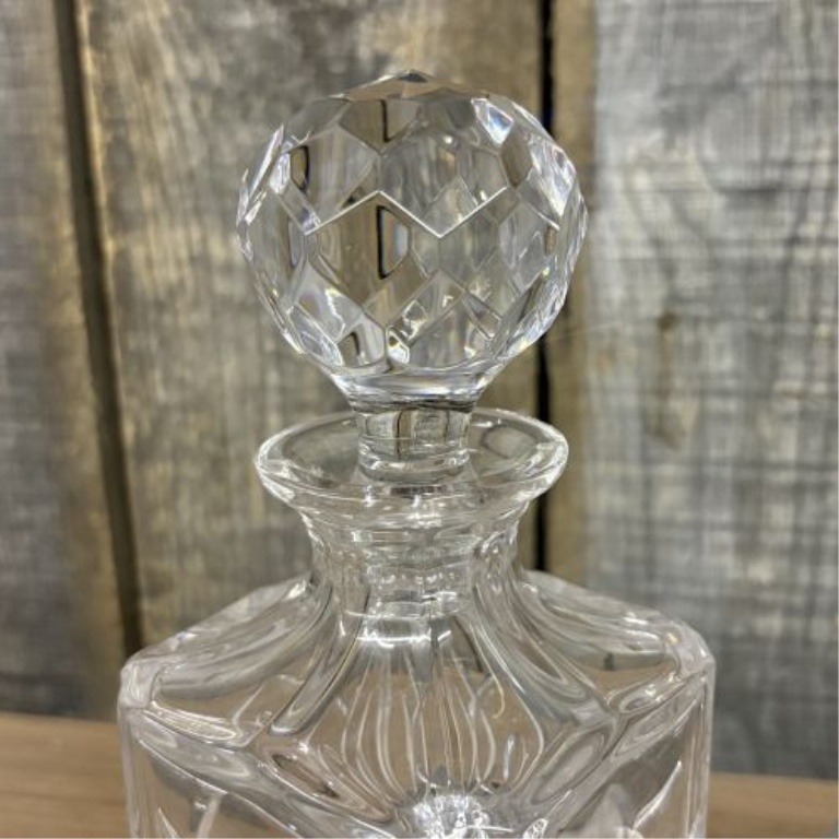 Two Glass Decanters Including a Square Cut Crystal Spirit Decanter and a Flared Decanter with Metallic Trim