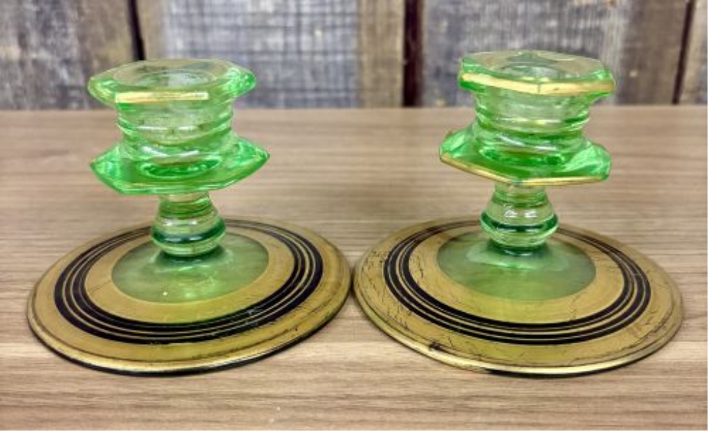 A Pair of Art Deco Green Uranium Glass Candlesticks with Gilt and Enamel Decoration