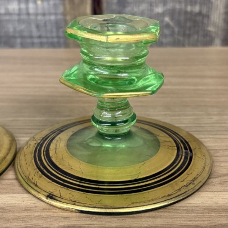A Pair of Art Deco Green Uranium Glass Candlesticks with Gilt and Enamel Decoration