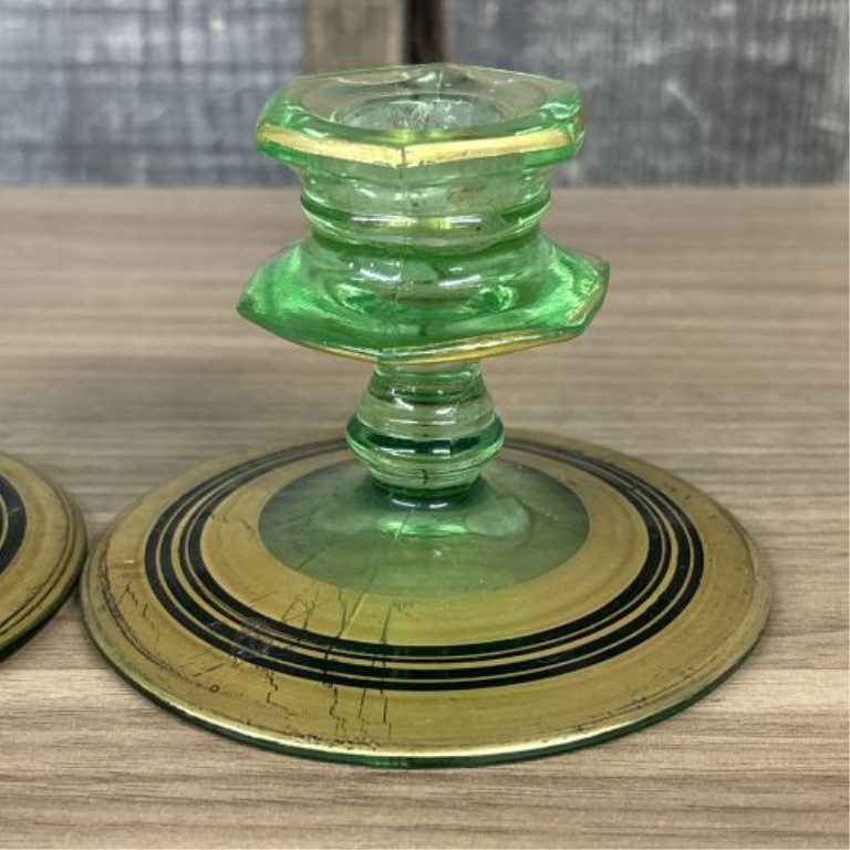 A Pair of Art Deco Green Uranium Glass Candlesticks with Gilt and Enamel Decoration