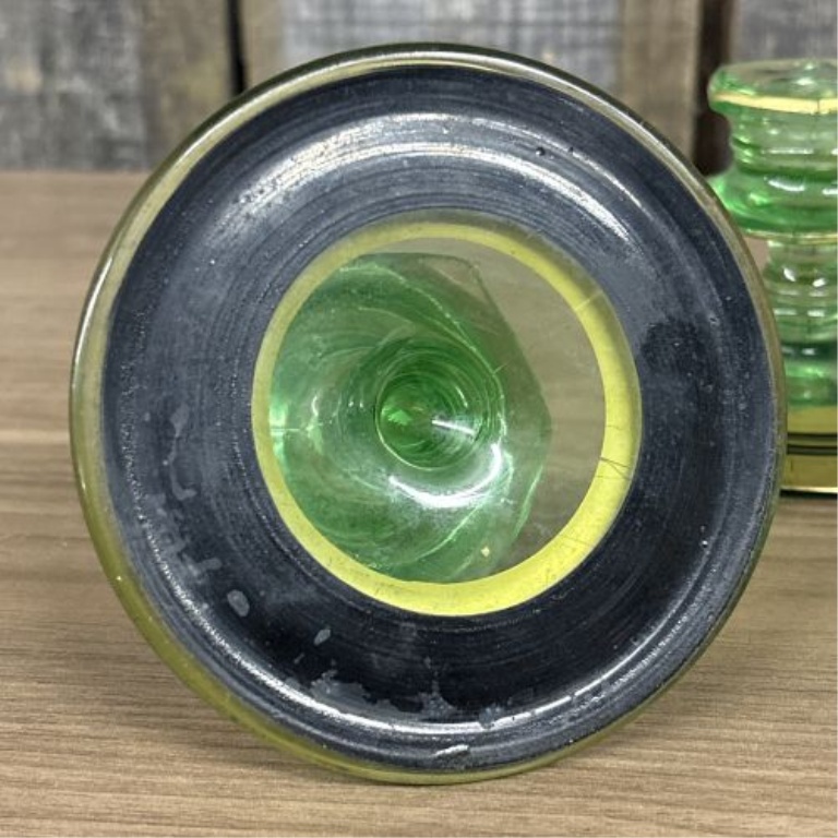 A Pair of Art Deco Green Uranium Glass Candlesticks with Gilt and Enamel Decoration