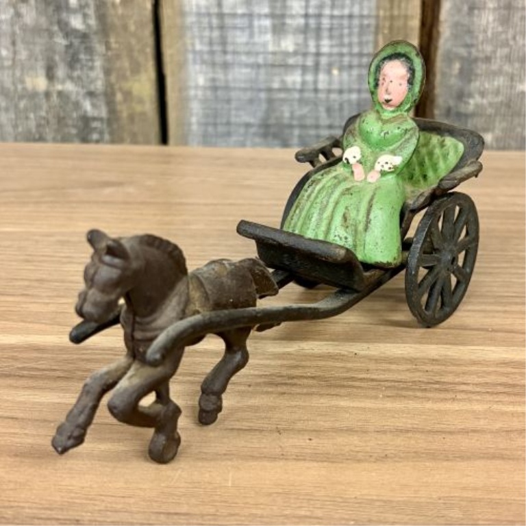Horse-Drawn Buggy with Seated Female Figure