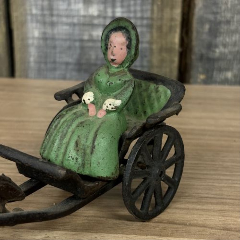 Horse-Drawn Buggy with Seated Female Figure
