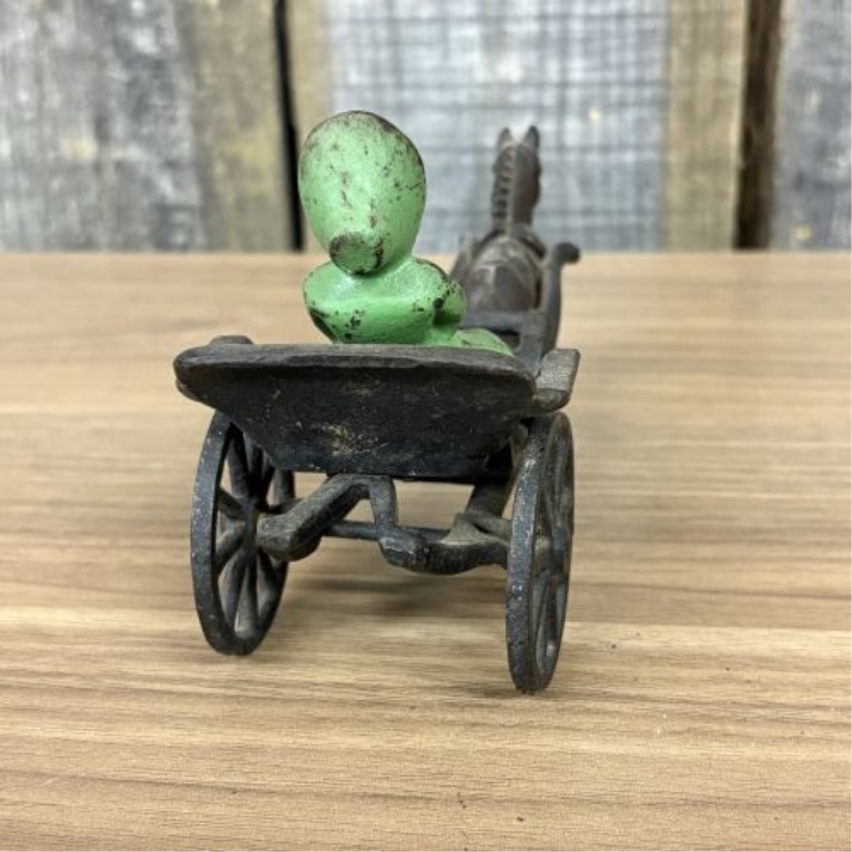 Horse-Drawn Buggy with Seated Female Figure