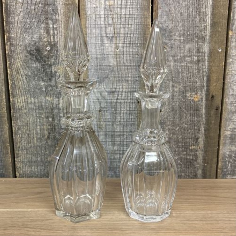 A Pair of Cut Glass Liquor Decanters with Metal Labels and Spire Stoppers
