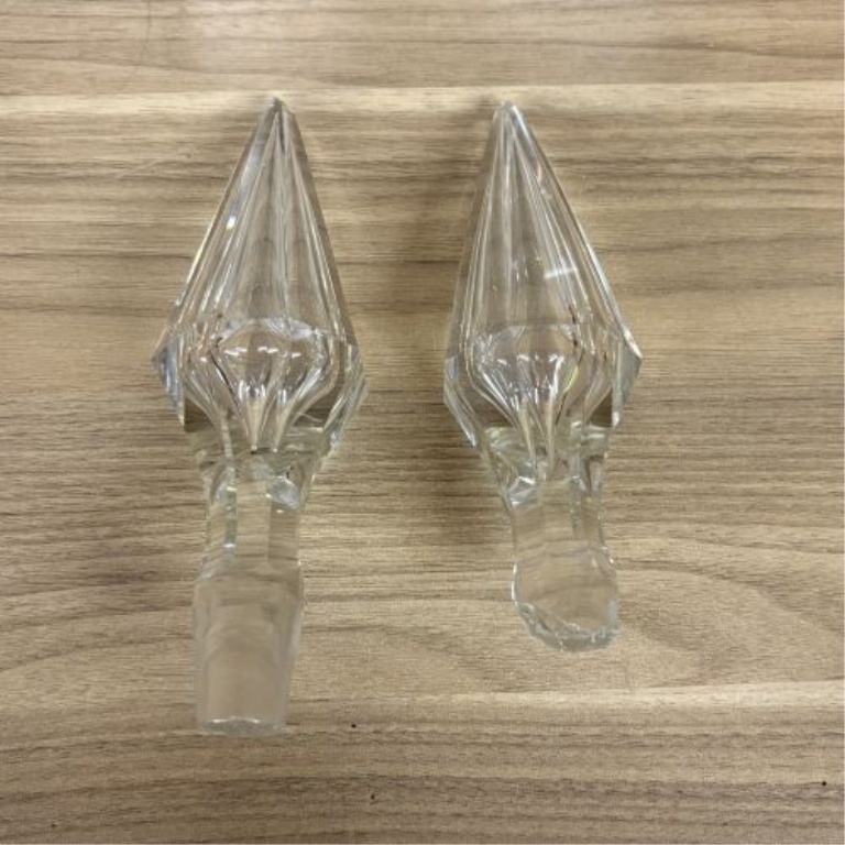 A Pair of Cut Glass Liquor Decanters with Metal Labels and Spire Stoppers