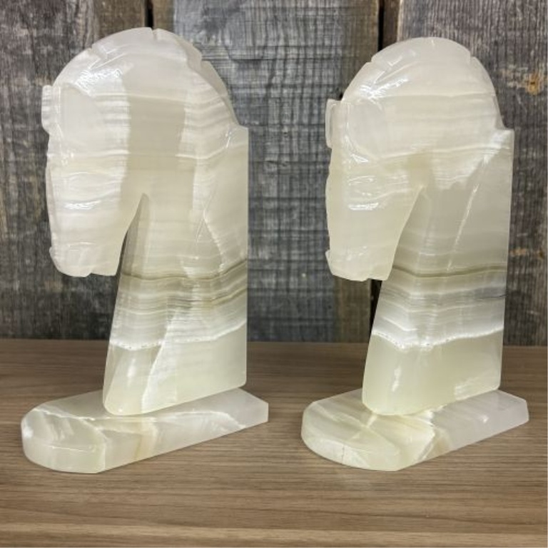 A Pair of Art Deco Style Hand Carved Banded Onyx Horse Head Bookends