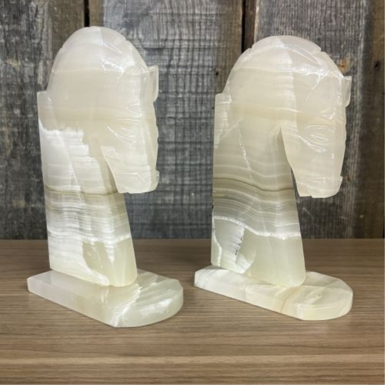 A Pair of Art Deco Style Hand Carved Banded Onyx Horse Head Bookends
