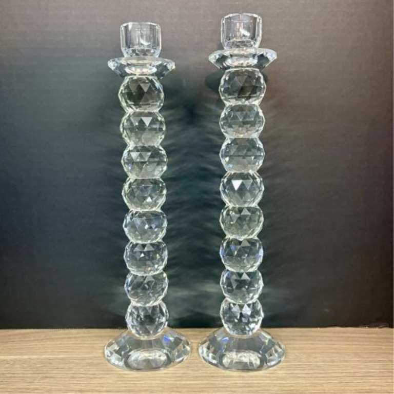 A Pair of Tall Faceted Stacked Crystal Taper Candlesticks