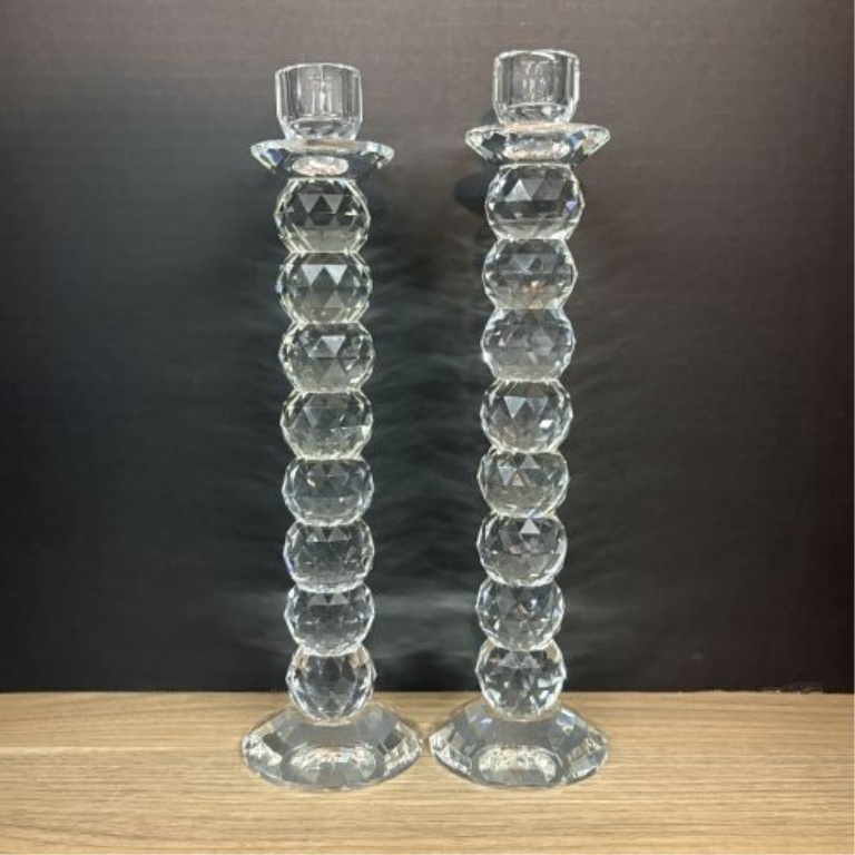 A Pair of Tall Faceted Stacked Crystal Taper Candlesticks