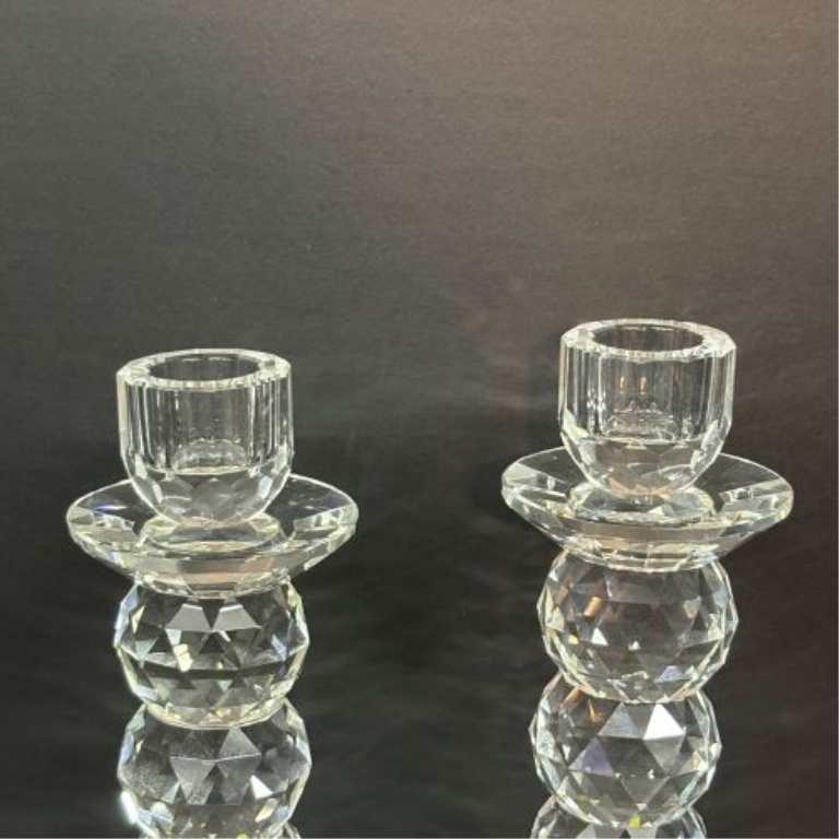 A Pair of Tall Faceted Stacked Crystal Taper Candlesticks
