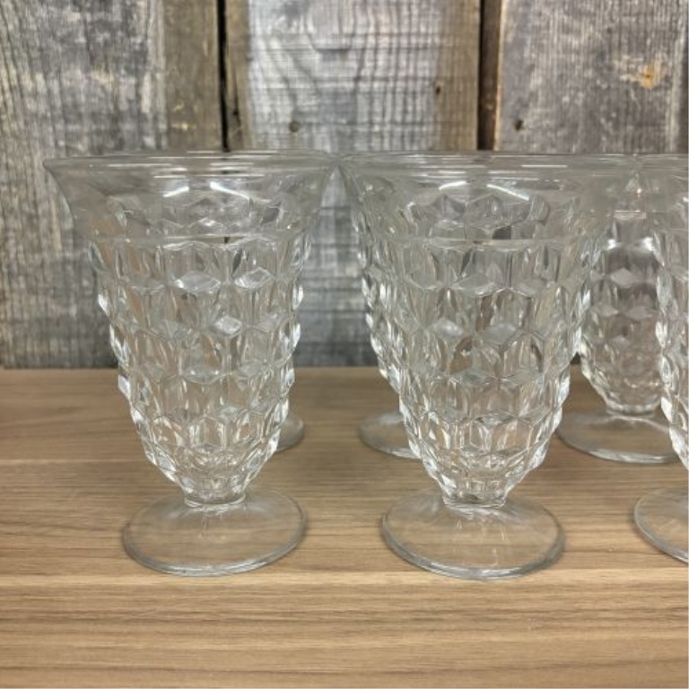 A Set of Eight Clear Pressed Glass Footed Iced Tea Tumblers in the Cube Pattern