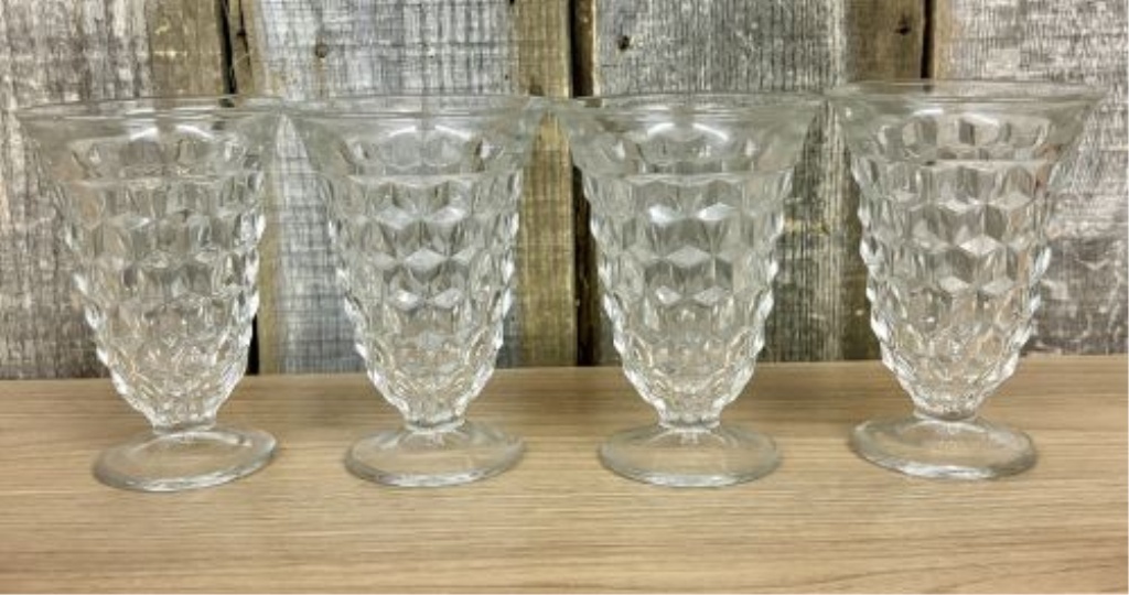 A Set of Eight Clear Pressed Glass Footed Iced Tea Tumblers in the Cube Pattern