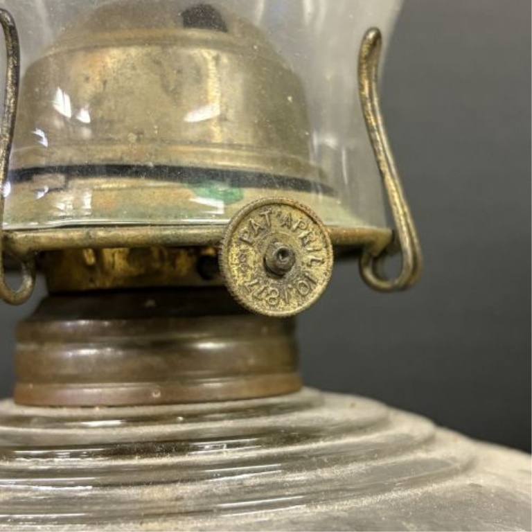 Two Antique Glass Kerosene Oil Lamps Including One with Cast Iron Base