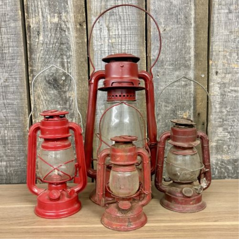 A Collection of Vintage Red Kerosene Lanterns