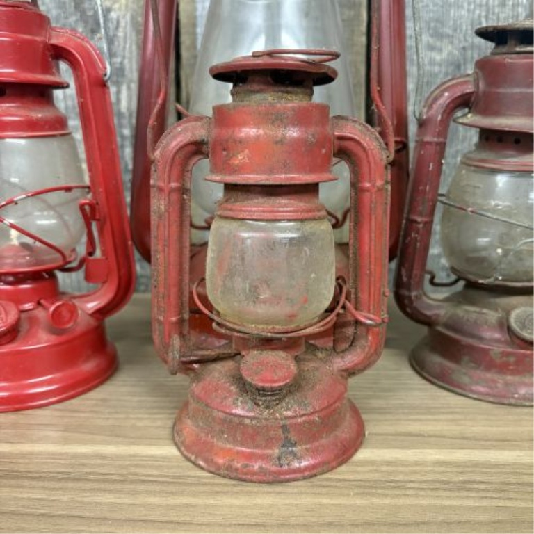 A Collection of Vintage Red Kerosene Lanterns