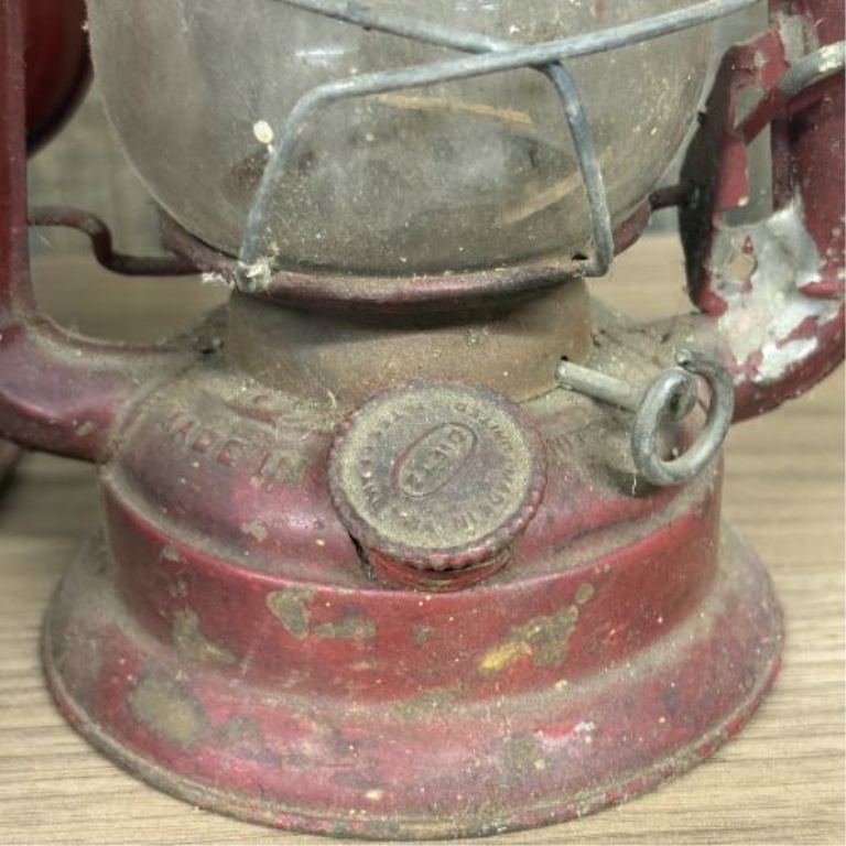A Collection of Vintage Red Kerosene Lanterns