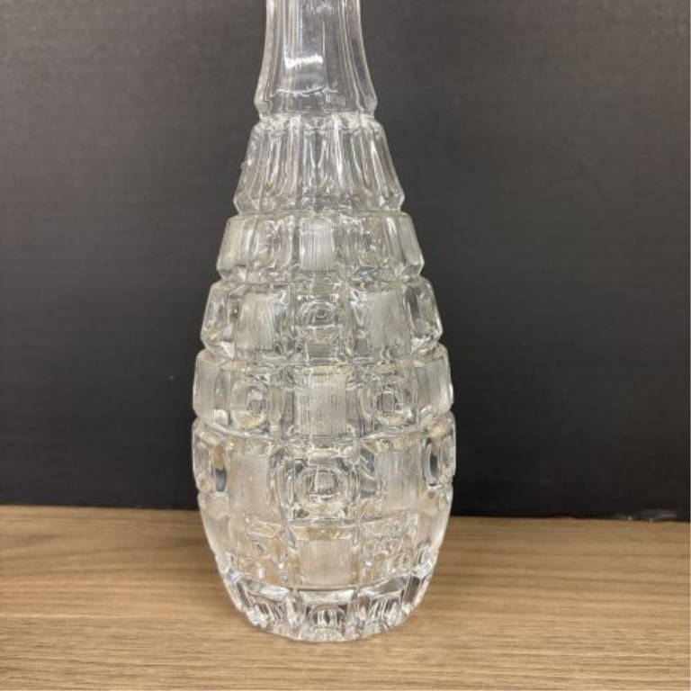 A Trio of Assorted Vintage Clear Glass Decanters