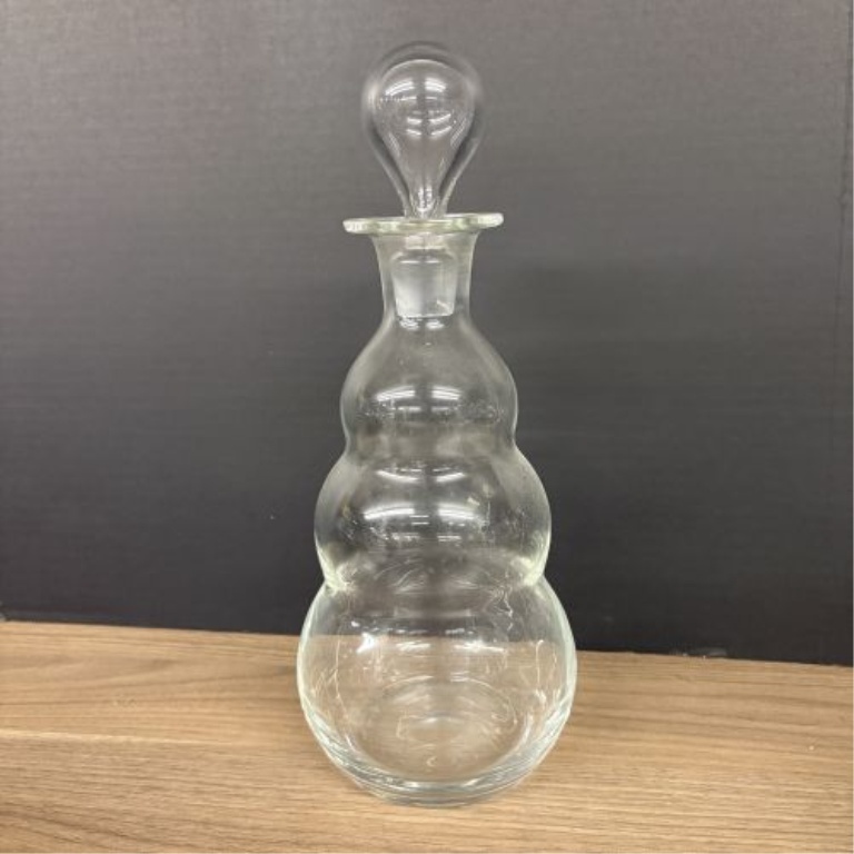 A Trio of Assorted Vintage Clear Glass Decanters