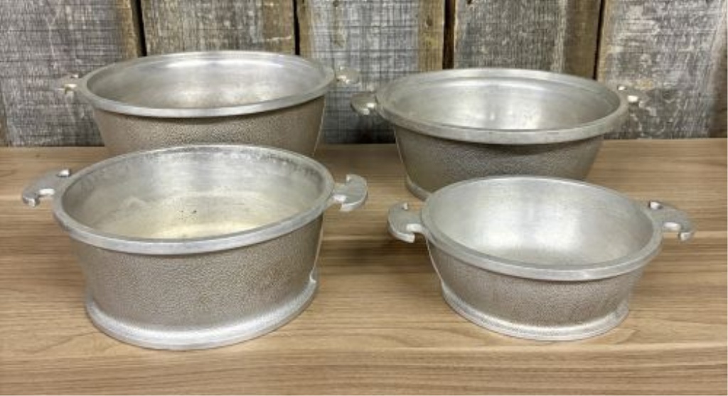 A Set of Four Graduated Cast Aluminum Nesting Bowls Attributed to Guardian Service Ware