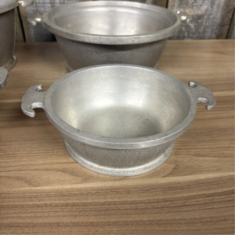 A Set of Four Graduated Cast Aluminum Nesting Bowls Attributed to Guardian Service Ware