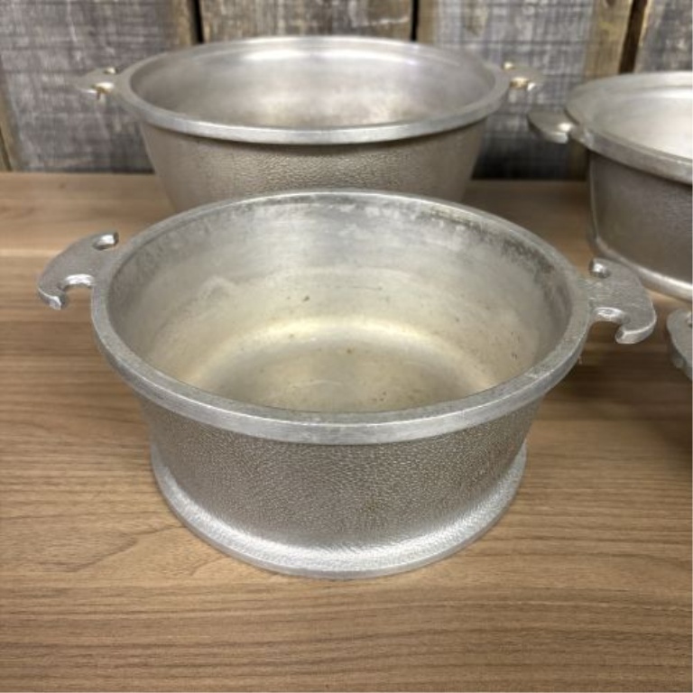A Set of Four Graduated Cast Aluminum Nesting Bowls Attributed to Guardian Service Ware