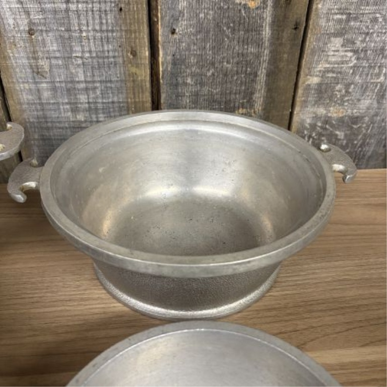 A Set of Four Graduated Cast Aluminum Nesting Bowls Attributed to Guardian Service Ware