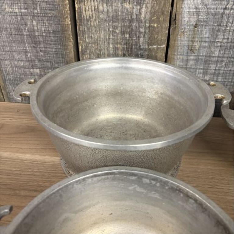 A Set of Four Graduated Cast Aluminum Nesting Bowls Attributed to Guardian Service Ware
