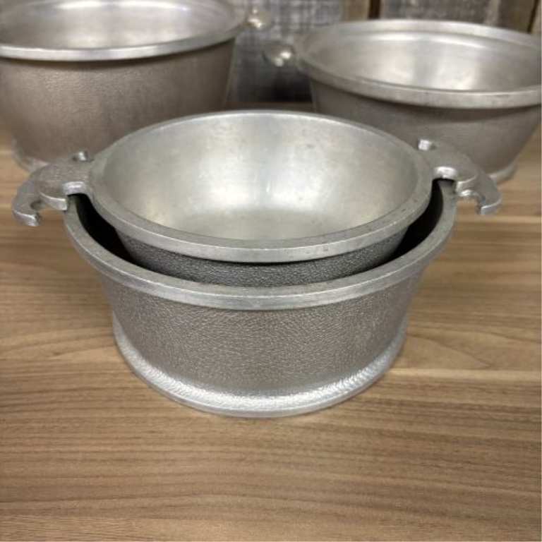 A Set of Four Graduated Cast Aluminum Nesting Bowls Attributed to Guardian Service Ware